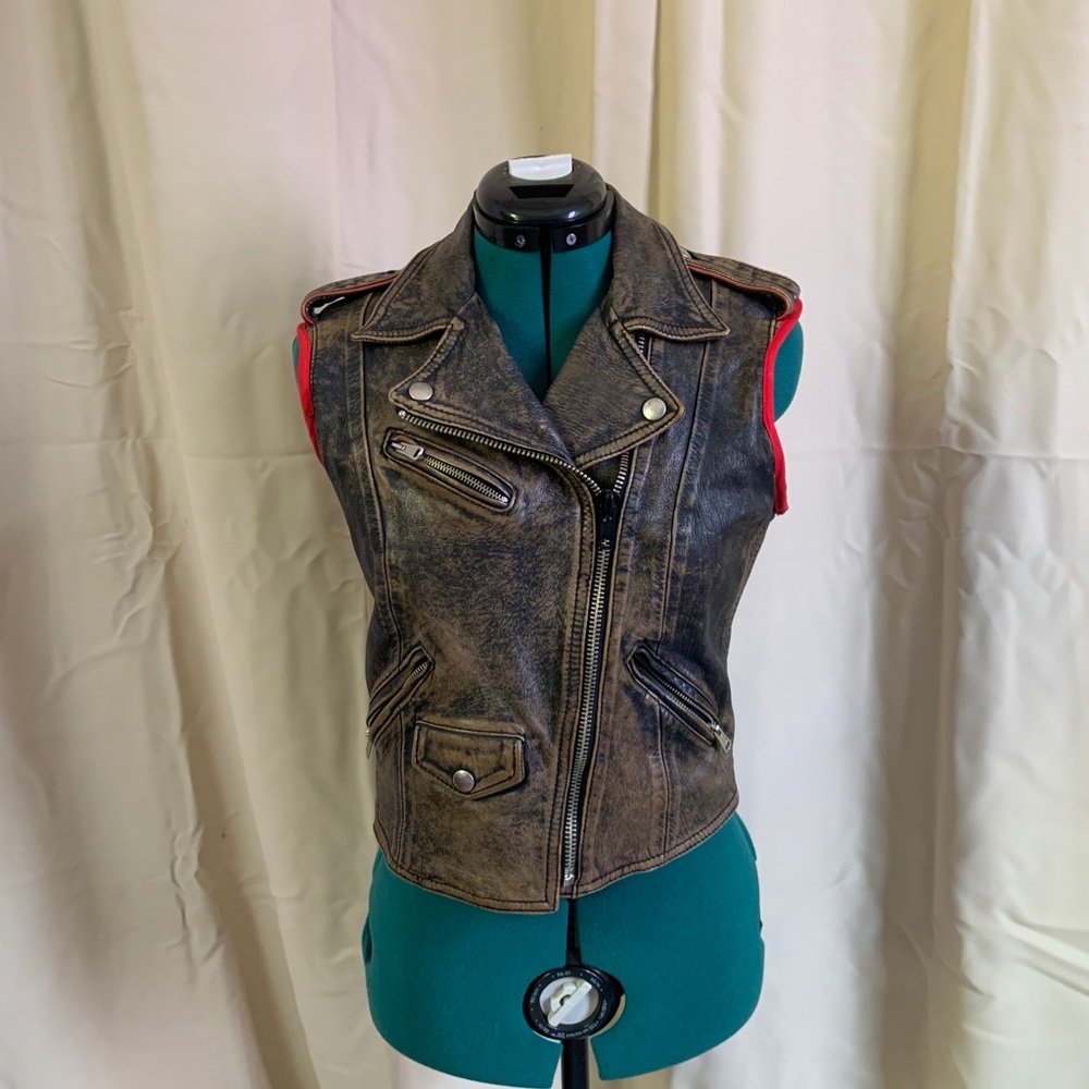 XS genuine leather motorcycle vest in brown leather with red trim.